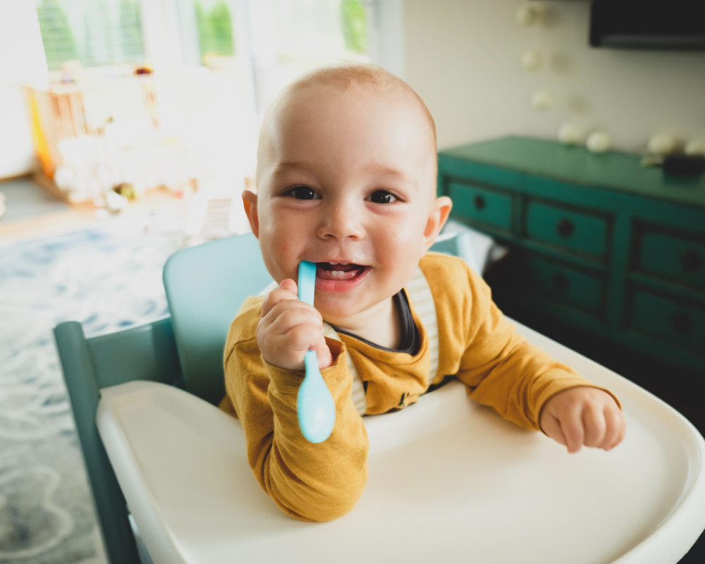 baby eating cereal